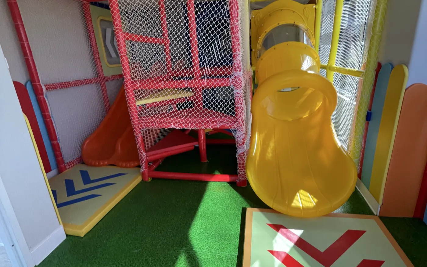 Indoor playground with slides and climbing nets at BTS